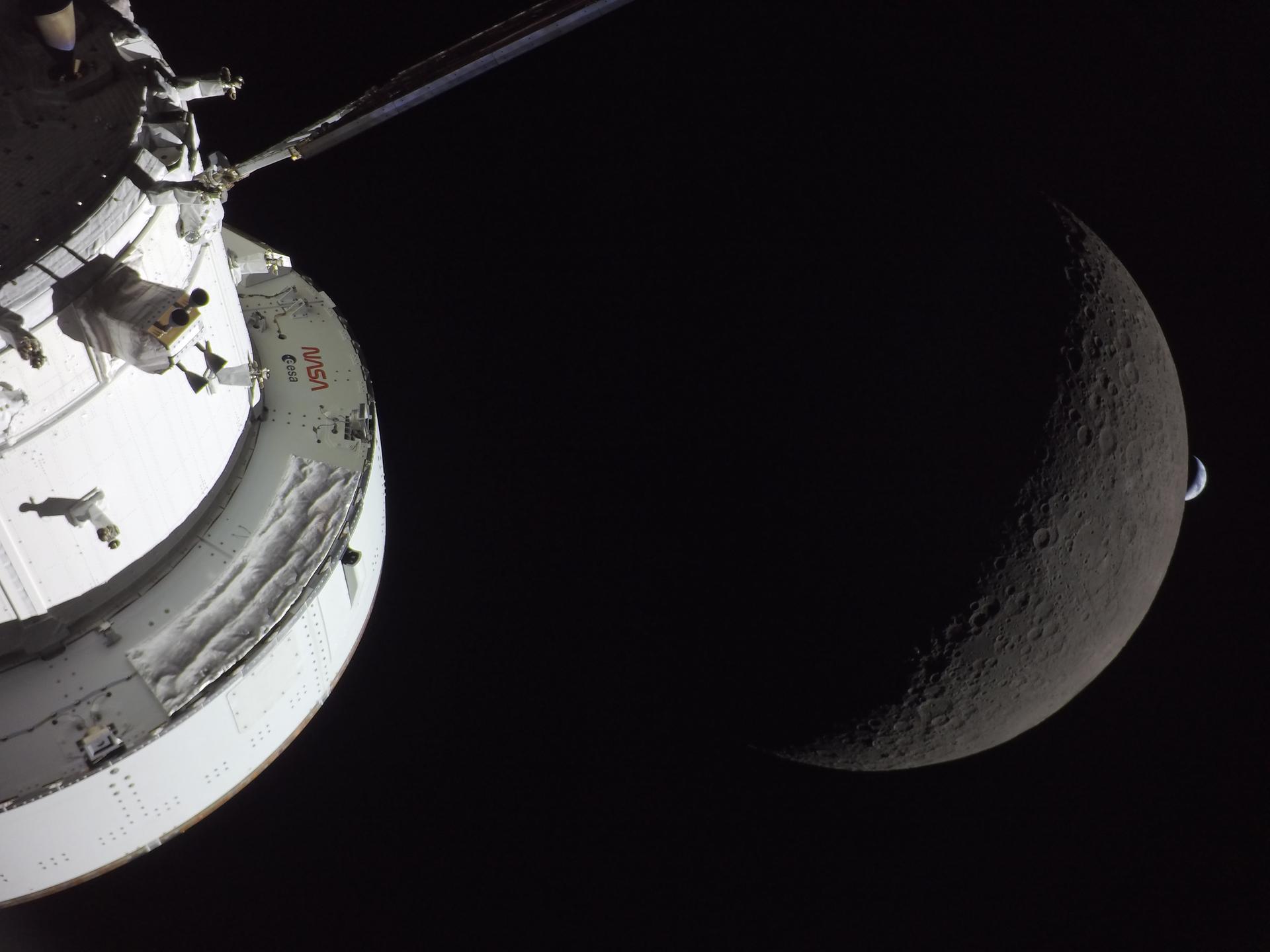 The Moon and Earth seen in one frame from Orion's solar array camera