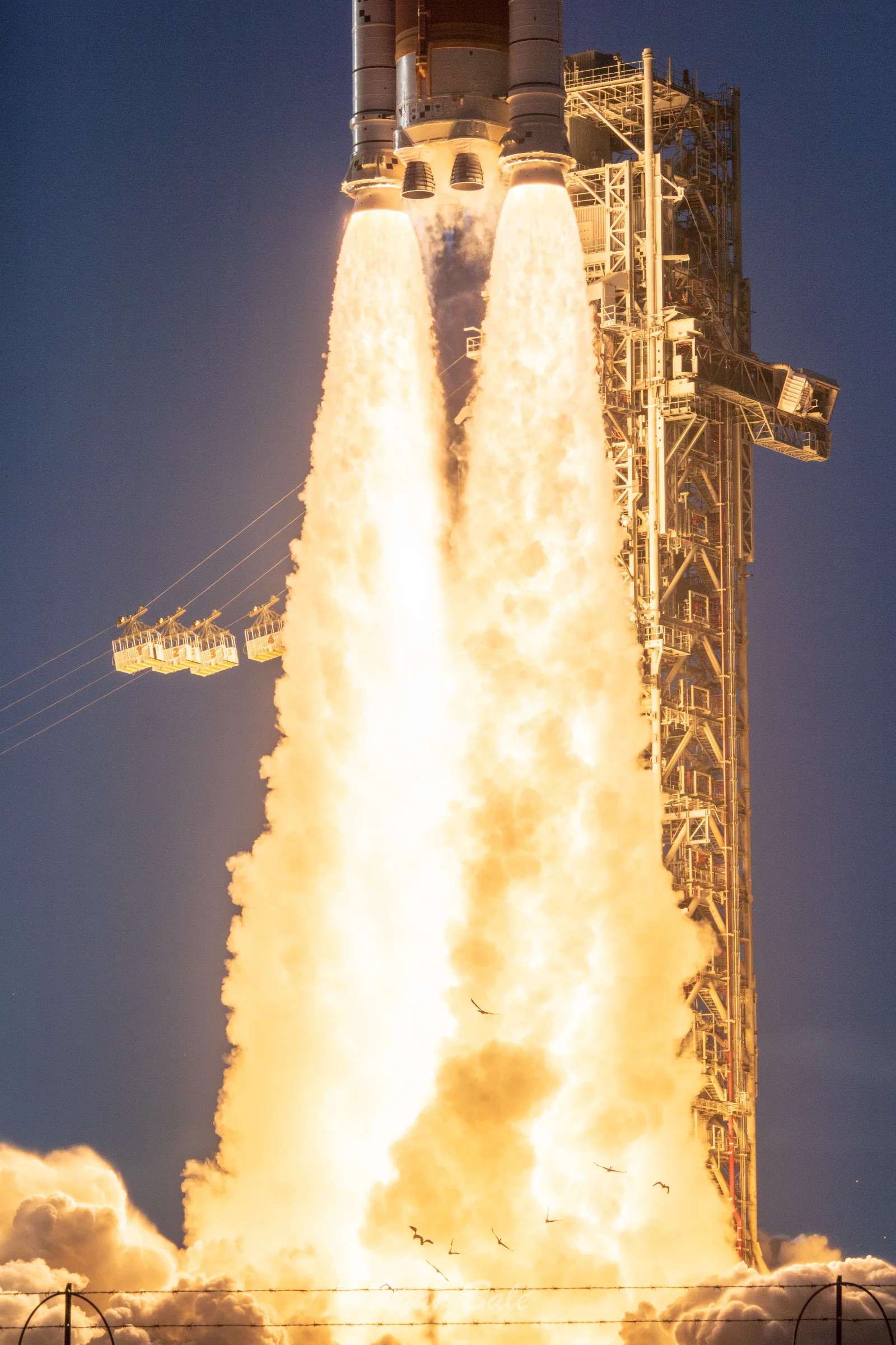 SLS ascending from LC-39B at dusk